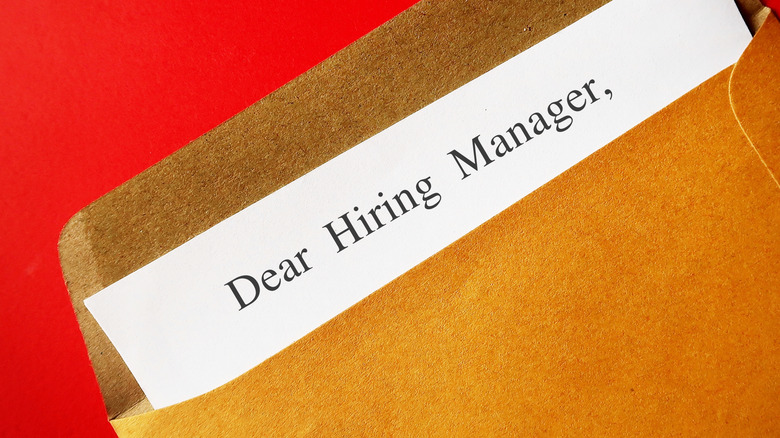A white paper inside a brown envelope.