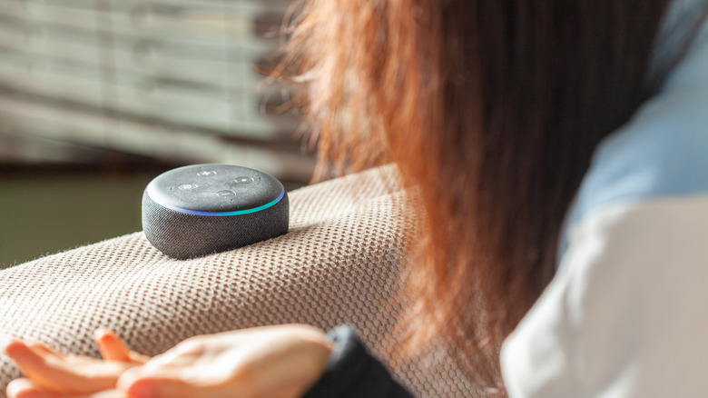 Woman talking to Amazon Echo speaker