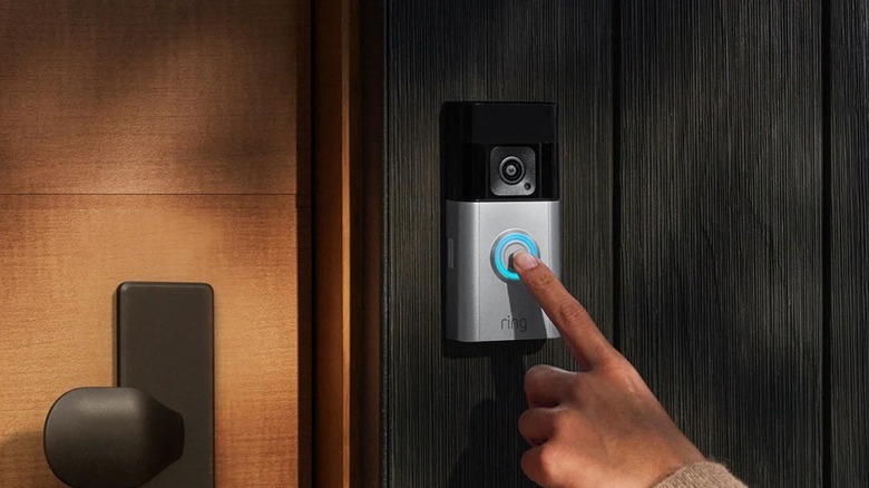 Person pressing Ring doorbell