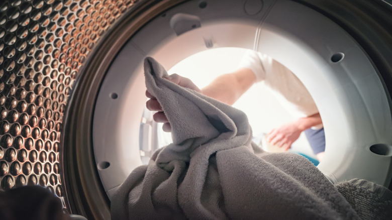 Person removing laundry from dryer