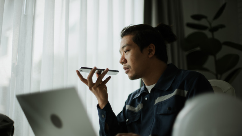 Man speaking into phone