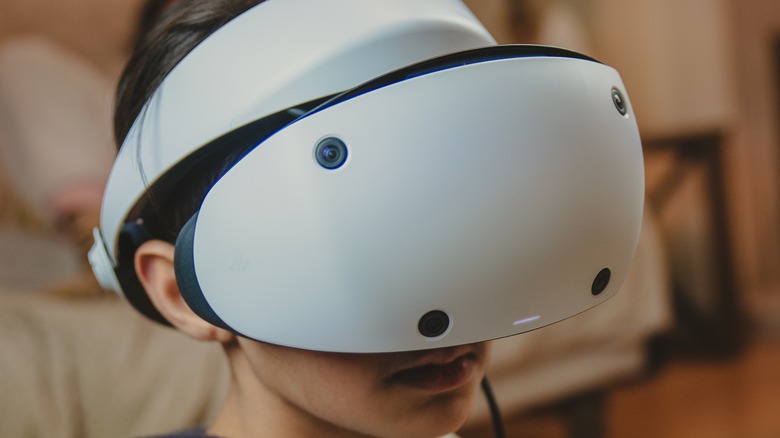 Child using PS VR2 headset
