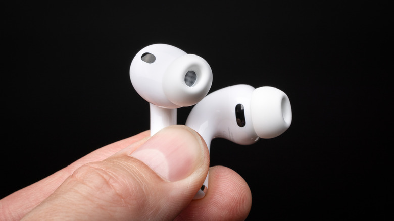 Close-up of AirPods Pro 3 being held