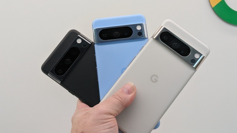 three Pixel 8 Pro phones