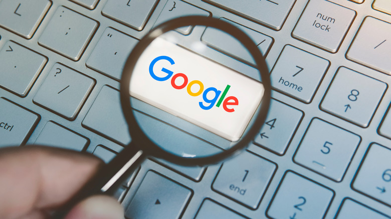 Google logo under magnifying glass