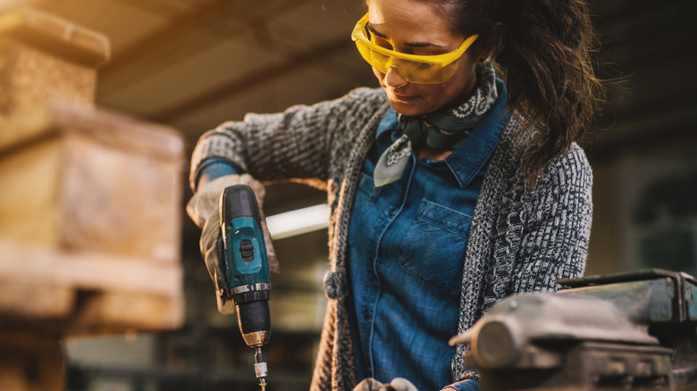 Person using cordless drill