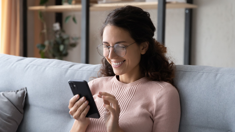 woman holding smartphone