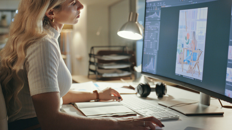 woman editing photo on computer