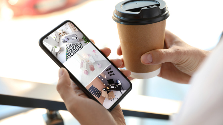 Person watching live security camera feed on their smartphone