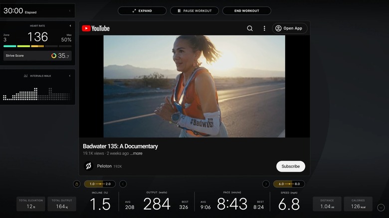 Peloton Entertainment display with YouTube video and metrics