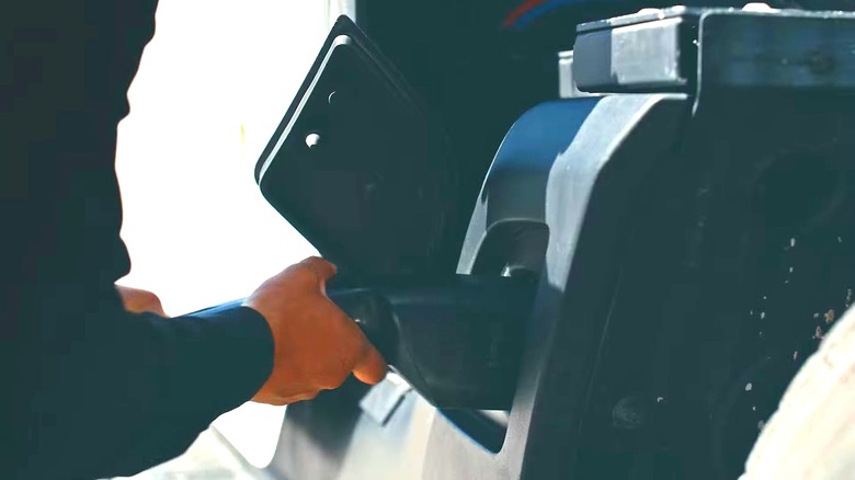 A driver charging a Tesla semi