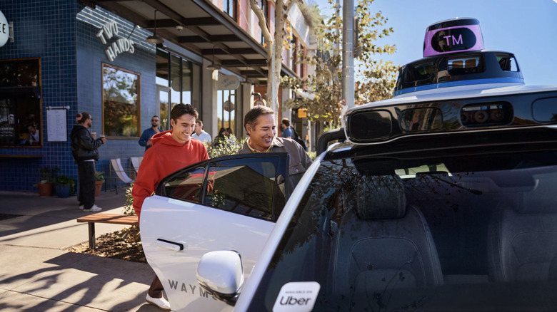 Person getting into a driverless Uber.
