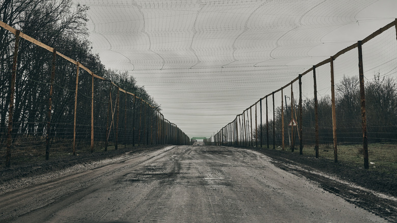Road secured with nets from both sides