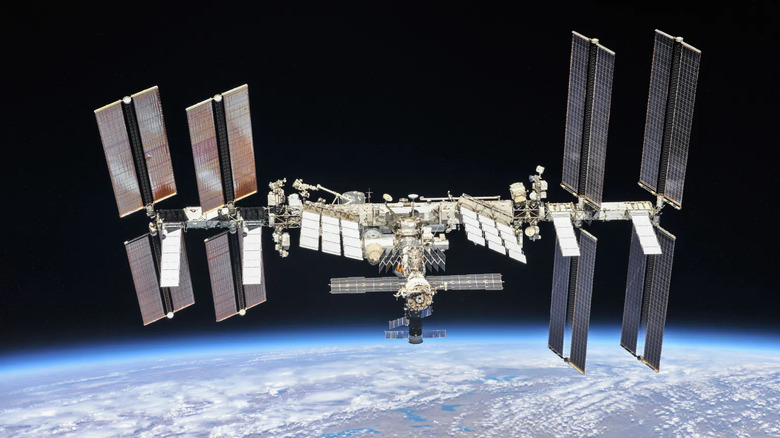 Full view of the ISS orbiting above Earth