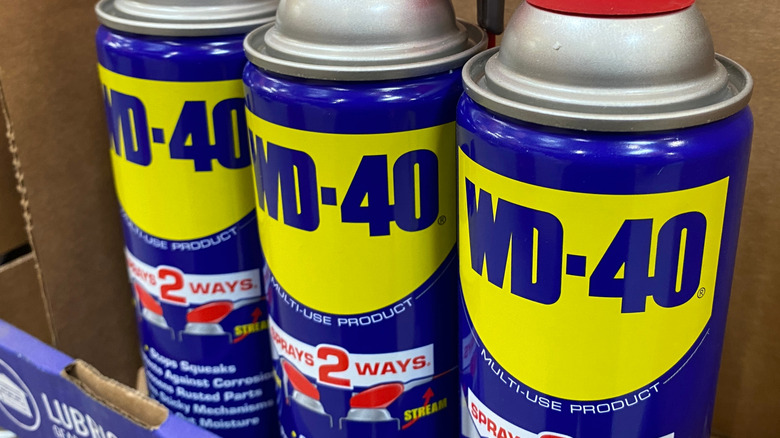 Cans of WD-40 in a box.