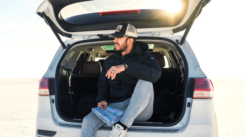Man sitting in the back of SUV in Ororo heated jacket
