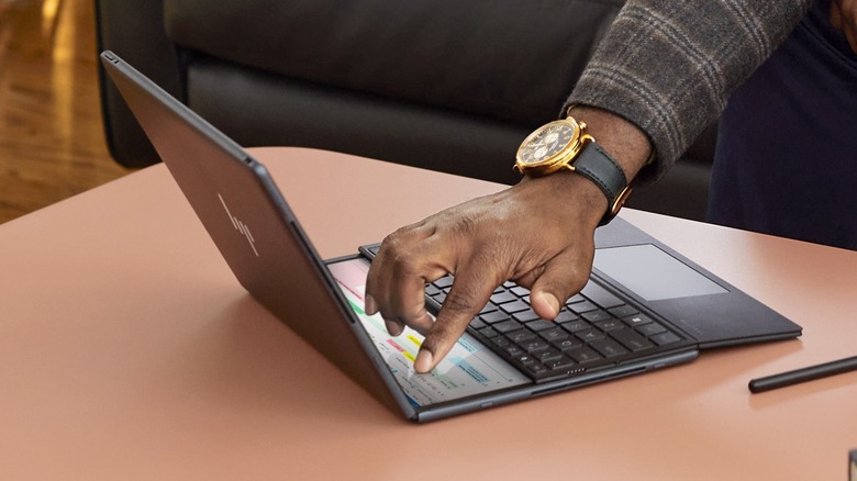 Person using the HP Foldable PC.