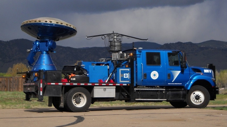 A blue Doppler on Wheels truck parked on the road