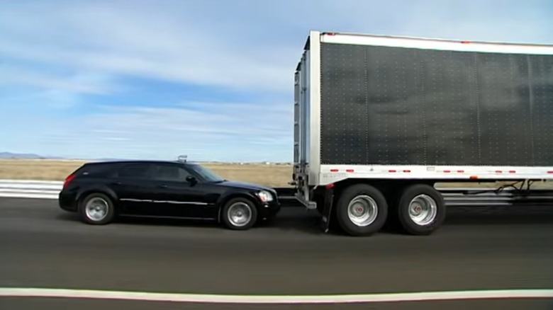 A person drafting behind a semi truck