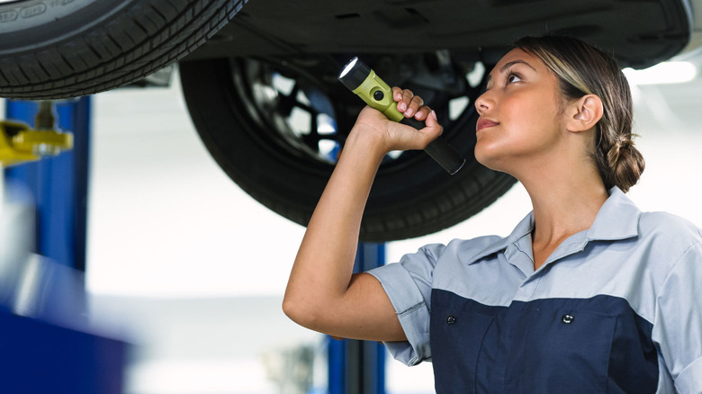 A Hyundai technician inspects a car