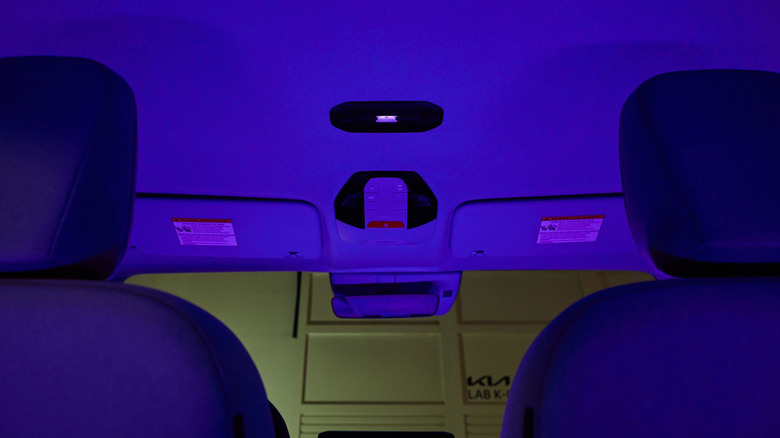 The interior of a Kia test vehicle illuminated by a UV sanitizing lamp