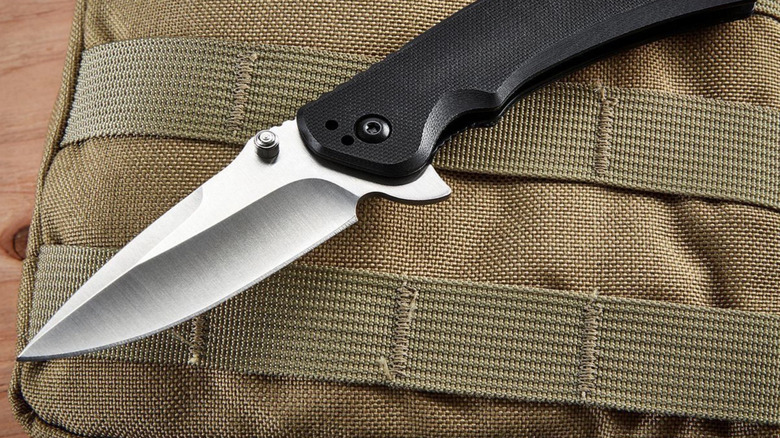 Gordon Pocket Knife sitting on top of a camping pack