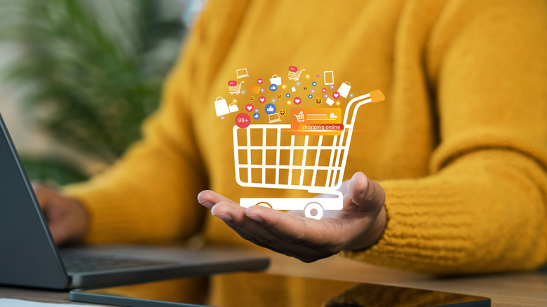 Illustration of a shopping cart over a person's hand