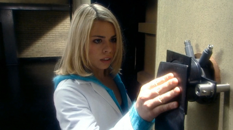Rose Tyler unlocks a door with psychic paper