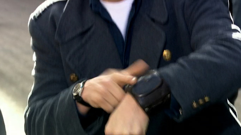 Captain Harkness's Vortex Manipulator is seen on his wrist
