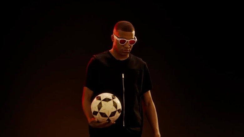 Man holding soccer ball and wearing Oakley Meta HSTN