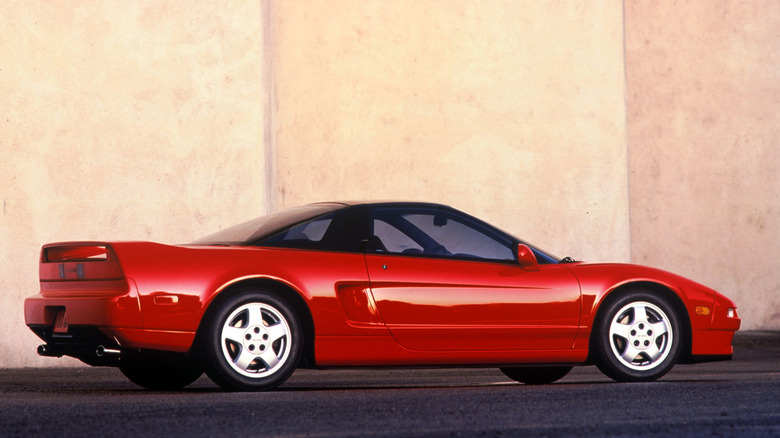 1993 Acura NSX parked with white concrete background, right-side view