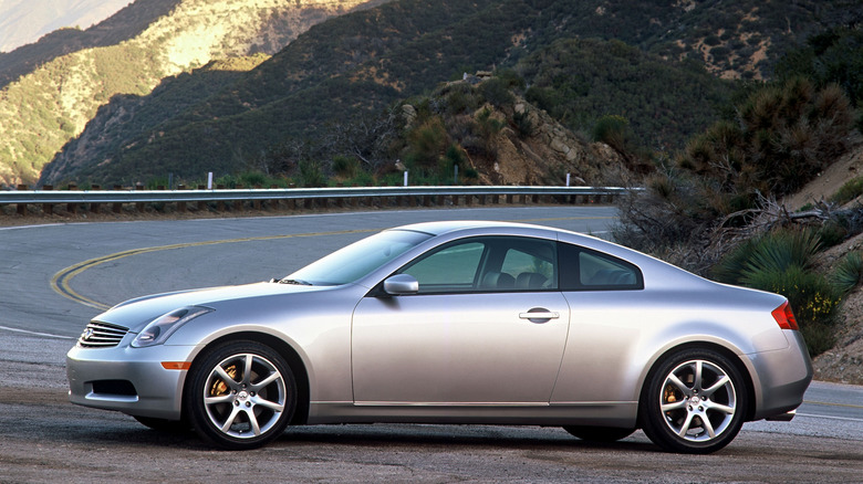 2003 Infiniti G35 parked alongside Pacific Coast Highway at sunset, left-side view