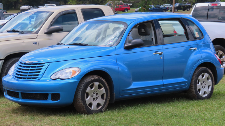 Blue 2008 Chrysler PT Cruiser LX parked on grass
