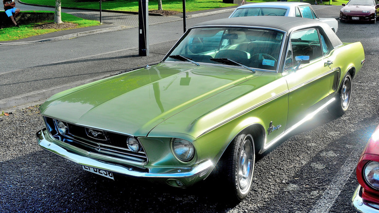 1968 Ford Mustang in green, parked on a lot