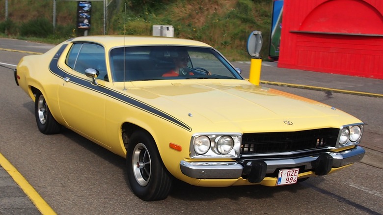 A yellow 1974 Plymouth Roadrunner like the one driven by Daisy Duke on the Dukes of Hazard television show.