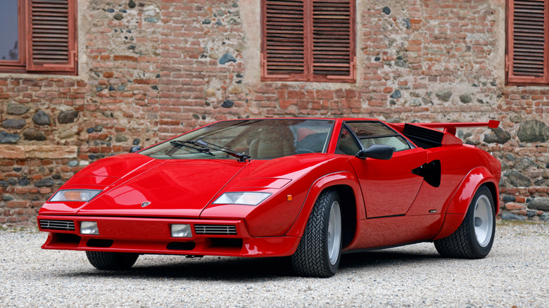 Picture showing a Lamborghini Countach parked in a gravel lot