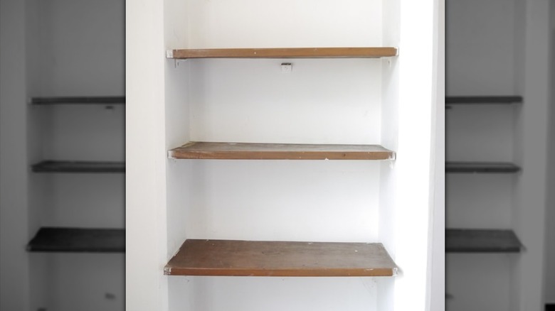 an empty recessed between-studs shelf