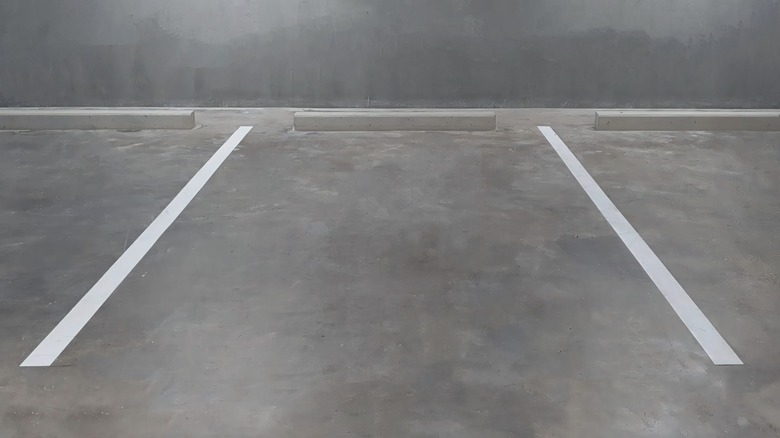 parking guide lines and a concrete parking bar