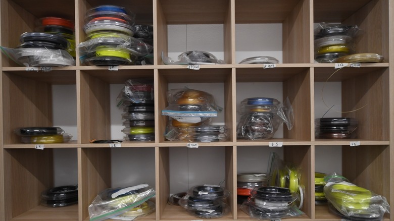 open shelves containing 3D printing filament