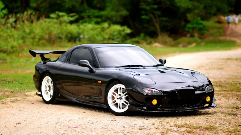 mazda rx-7 parked dirt