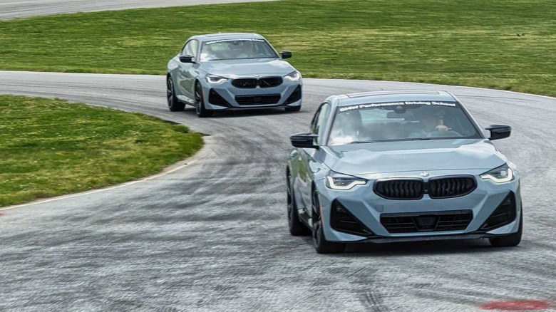 Two BMW 2 series on a track