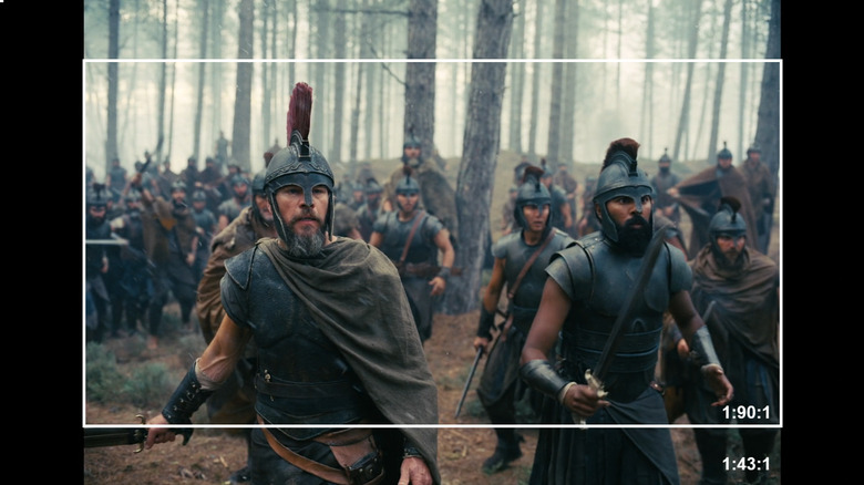 A still from "The Odyssey" showing the larger 70MM format 1:43:1 aspect ratio and a white box representing the IMAX with Laser 1:90:1 aspect ratio