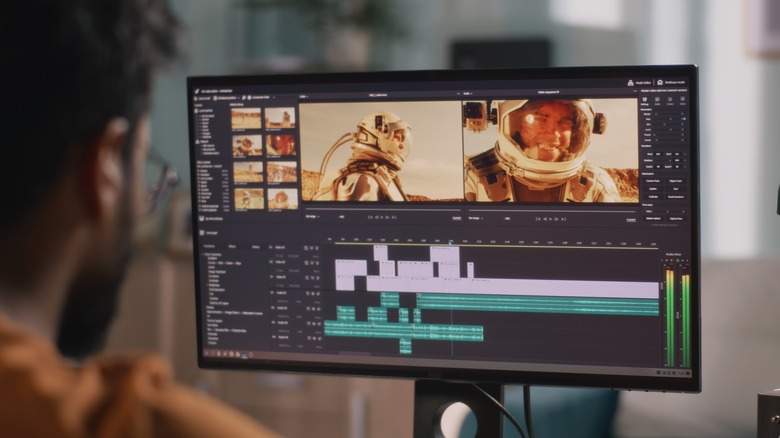 Man editing footage of an astronaut