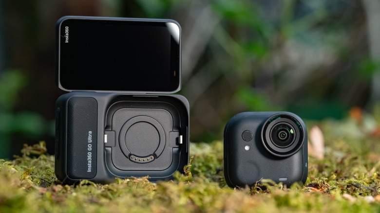 The Insta360 Go Ultra standalone camera next to the action pod.