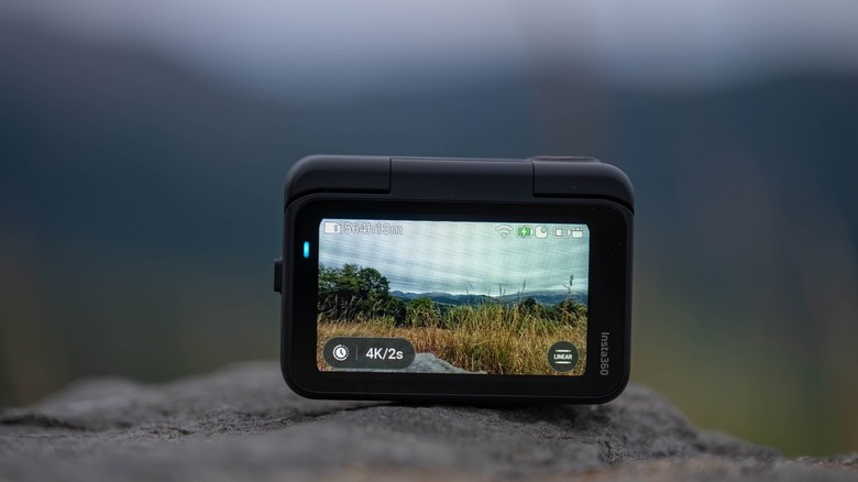 View of the display of the Insta360 Go Ultra sitting on a rock.