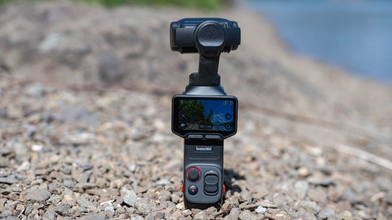 The insta360 Luna Ultra on a rocky beach.