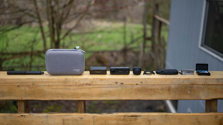 Insta360 X5 Essentials Bundle on a porch railing.