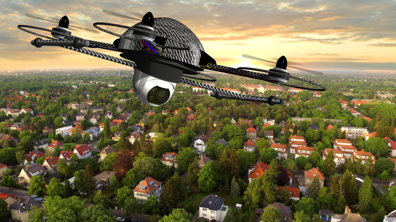 Computer rendering of a drone flying over a neighborhood