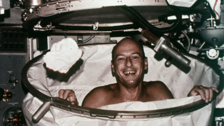 Skylab 2 commander Pete Conrad takes a shower in zero gravity.