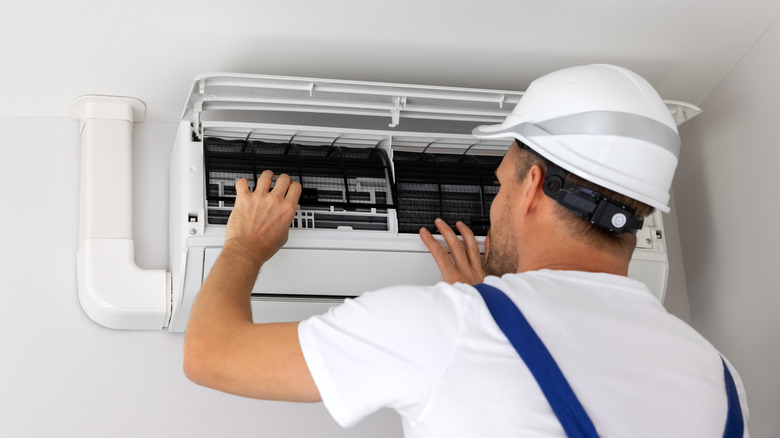 An AC unit undergoing maintenance